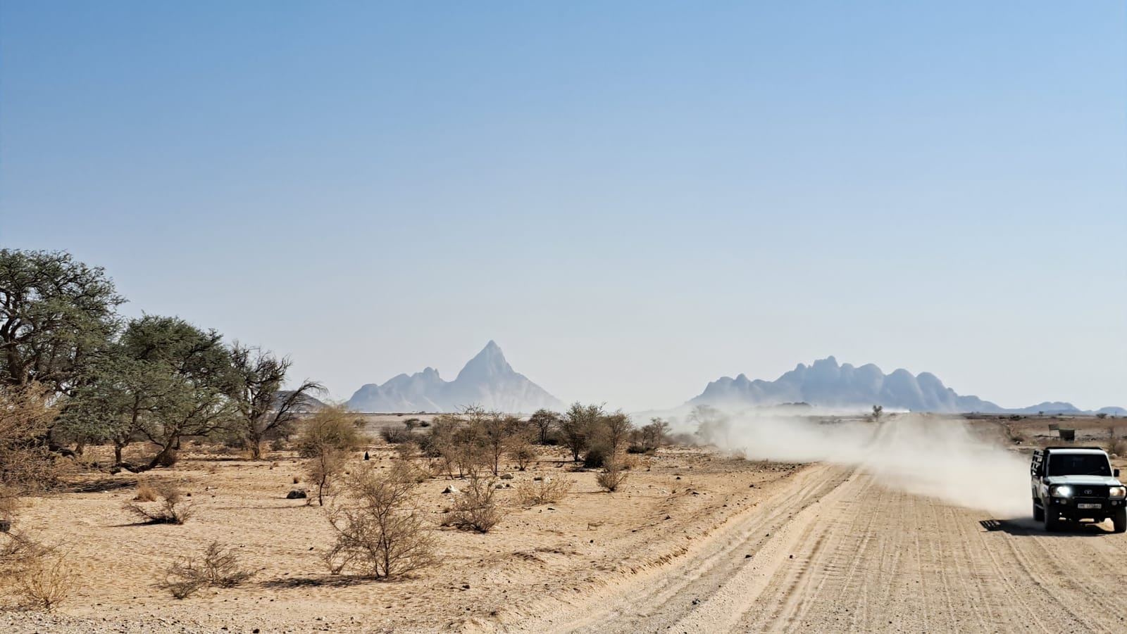The road into the Erongo — dust and granite peaks ahead