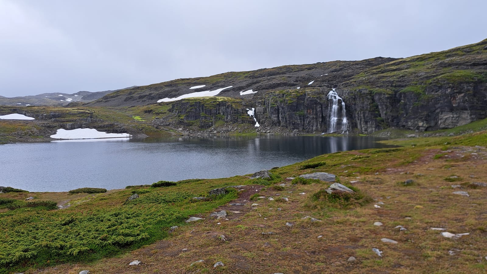 Small lakes and snowfields on the Aurlandsfjellet, the Snøvegen, in August