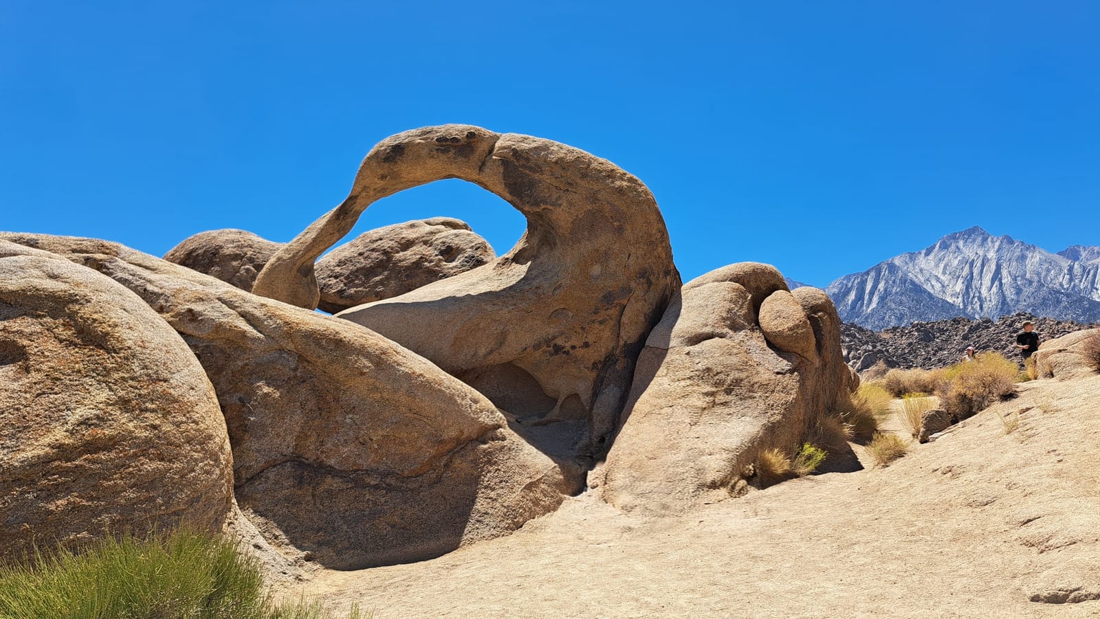A natural rock arch at Alabama Hills, with the Sierra Nevada behind