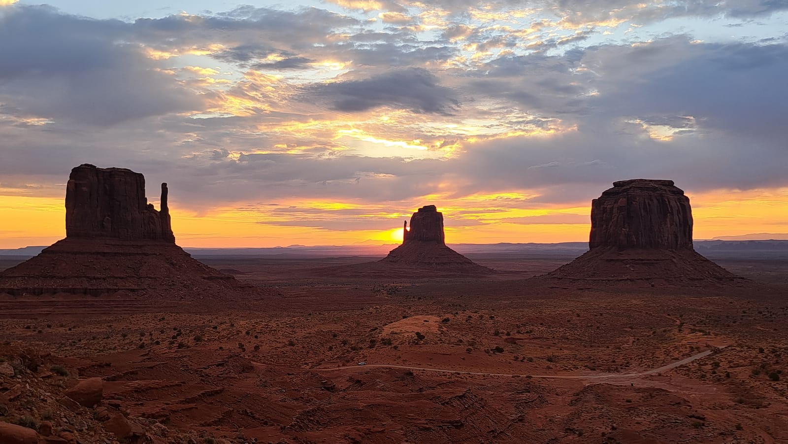 Sunrise behind the Mittens, Monument Valley